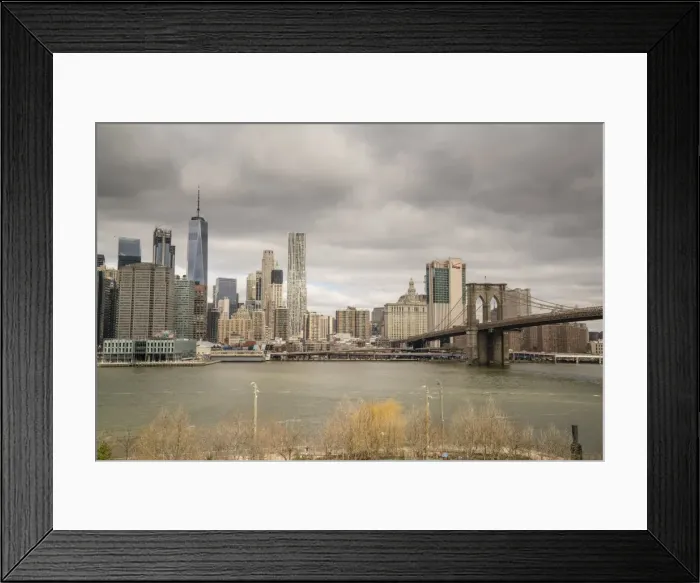 Framed Print : Manhattan skyline and Brooklyn Bridge on a cloudy day, New York City, United States of America Framed Print : Manhattan skyline and Brooklyn Bridge on a cloudy day, New York City, United States of America