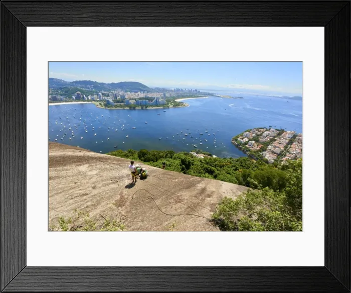 Framed Print : Abseilers in Morro da Urca in Rio de Janeiro with panoramic view in the background Framed Print : Abseilers in Morro da Urca in Rio de Janeiro with panoramic view in the background