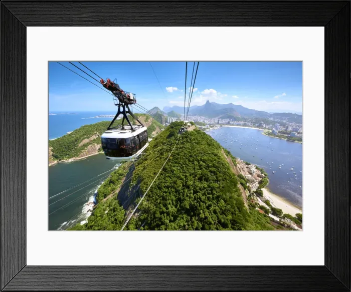 Framed Print : A motion blurred cable car approaches the station atop Sugarloaf mountain, with sweeping Framed Print : A motion blurred cable car approaches the station atop Sugarloaf mountain, with sweeping