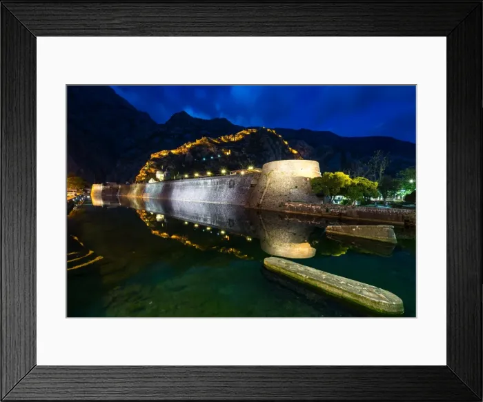 Framed Print : Part of Kotors old town wall and lit fortress ramparts reflected during the evening blue hour Framed Print : Part of Kotors old town wall and lit fortress ramparts reflected during the evening blue hour