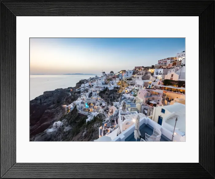 Framed Print : Sunset view over the whitewashed buildings and windmills of Oia, Santorini, Cyclades Framed Print : Sunset view over the whitewashed buildings and windmills of Oia, Santorini, Cyclades