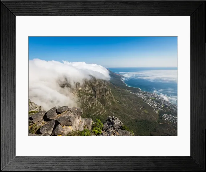 Framed Print : Table Mountain covered in a tablecloth of orographic clouds, Camps Bay below covered in low cloud Framed Print : Table Mountain covered in a tablecloth of orographic clouds, Camps Bay below covered in low cloud