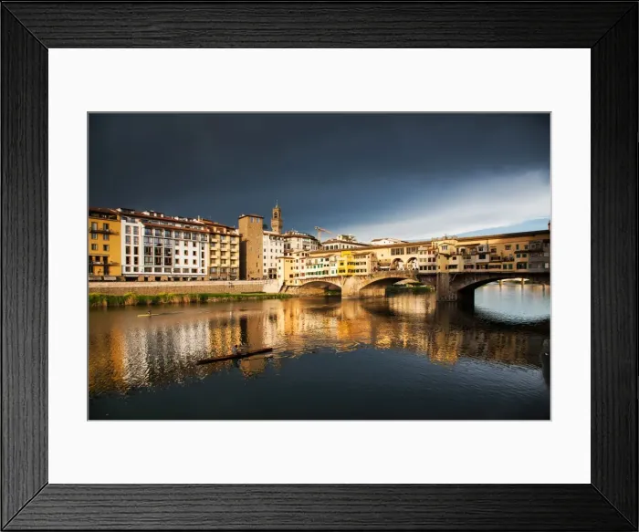 Framed Print : Ponte Vecchio reflected in the Arno River against a dark blue stormy sky, Florence Framed Print : Ponte Vecchio reflected in the Arno River against a dark blue stormy sky, Florence