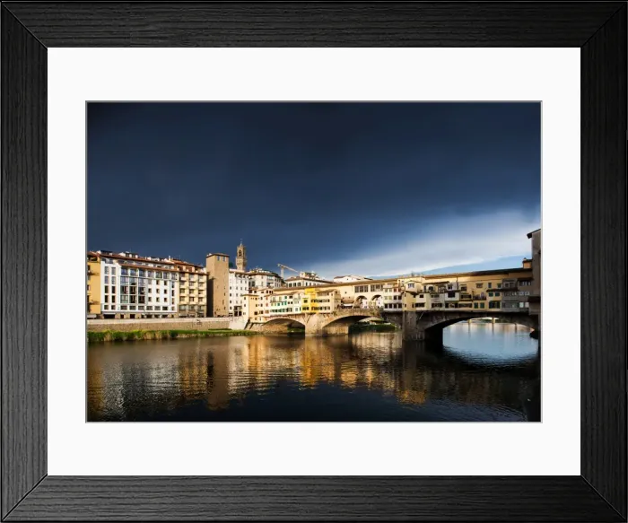 Framed Print : Ponte Vecchio reflecting in the Arno rRver against a dark blue stormy sky, Florence Framed Print : Ponte Vecchio reflecting in the Arno rRver against a dark blue stormy sky, Florence