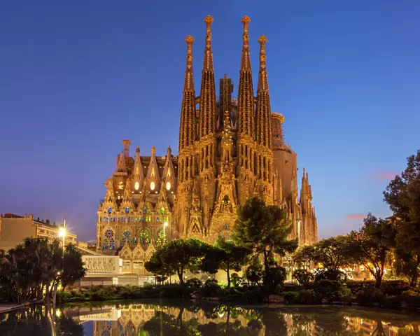 La Sagrada Familia church lit up at night designed by Antoni Gaudi, UNESCO World Heritage Site
