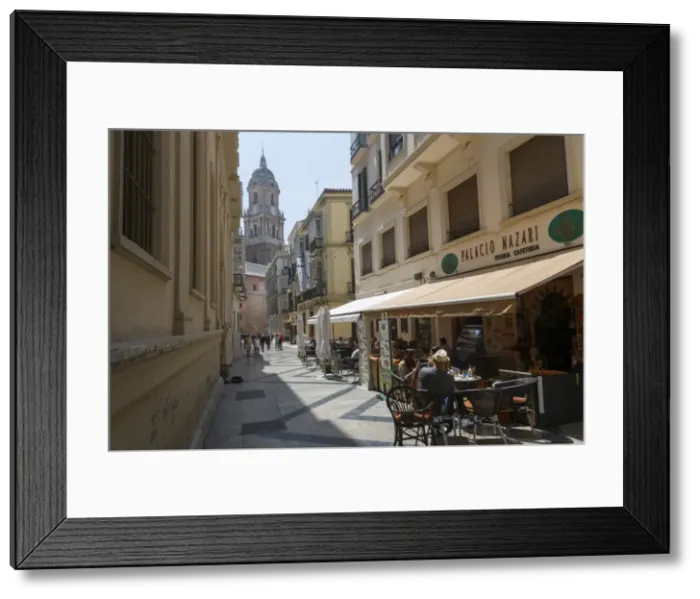 Framed Print : Malaga Cathedral and cafe in narrow street, Malaga, Costa del Sol, Andalusia, Spain Framed Print : Malaga Cathedral and cafe in narrow street, Malaga, Costa del Sol, Andalusia, Spain