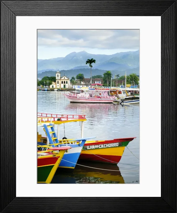Framed Print : Fishing boats in Paraty village with the mountains of the Serra da Bocaina behind