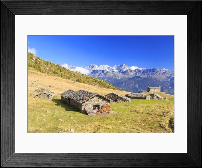 Framed Print : Alpine huts framed by snowy peaks of Bernina Group, Arcoglio Alp, Val Torreggio, Malenco Valley Framed Print : Alpine huts framed by snowy peaks of Bernina Group, Arcoglio Alp, Val Torreggio, Malenco Valley