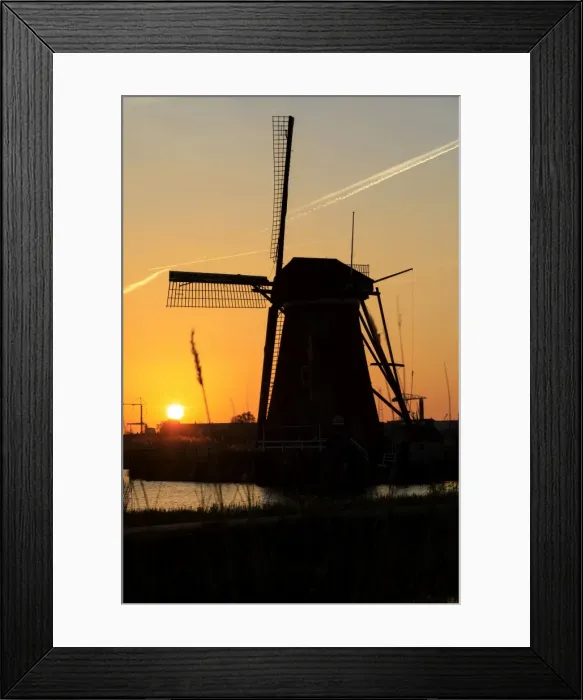 Framed Print : Silhouette of typical windmill framed by the fiery sky at sunset, Kinderdijk, UNESCO