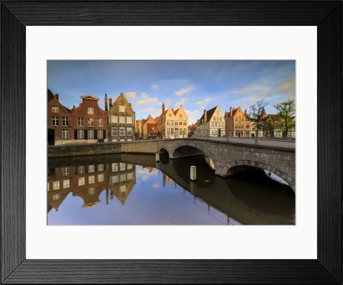 Framed Print : First light of sunrise on the historic buildings and bridge reflected in the typical canal