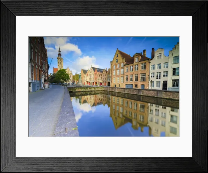Framed Print : Bright sky at dawn on historic buildings and houses of city centre reflected in the canal