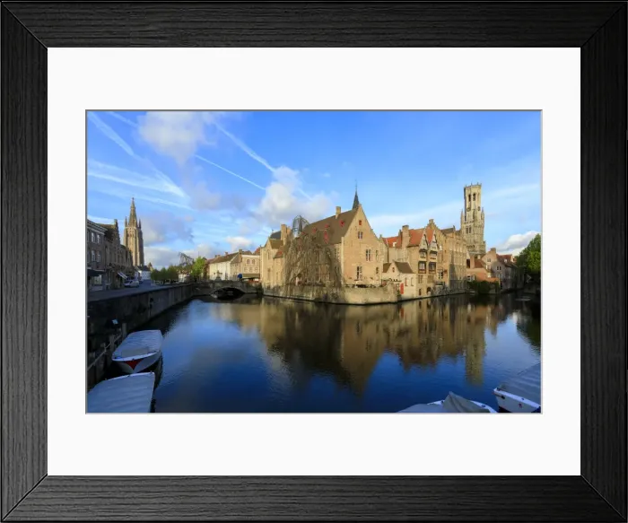 Framed Print : First light of dawn on the Belfry and historic buildings reflected in the typical canal
