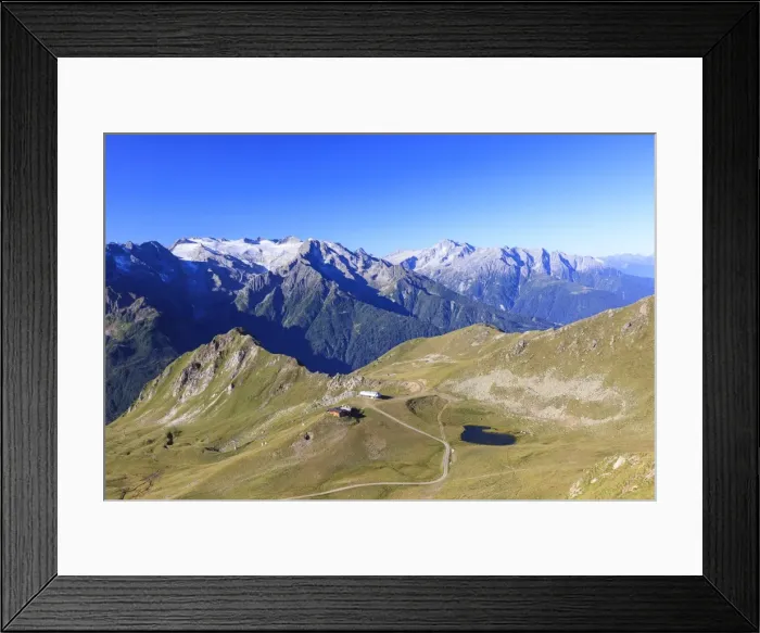 Framed Print : Green meadows and alpine lake framed by the high peaks in the Adamello Ski Area, Tonale Pass Framed Print : Green meadows and alpine lake framed by the high peaks in the Adamello Ski Area, Tonale Pass