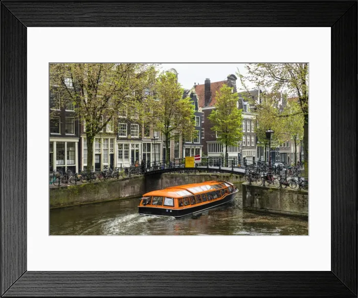 Framed Print : Canal boat passing under a bridge on Brouwersgracht, Amsterdam, Netherlands, Europe Framed Print : Canal boat passing under a bridge on Brouwersgracht, Amsterdam, Netherlands, Europe