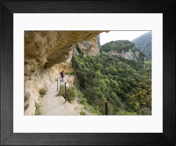 Framed Print : A woman hiking in the Taygetos Mountains above Mystras in the Peloponnese, Greece, Europe Framed Print : A woman hiking in the Taygetos Mountains above Mystras in the Peloponnese, Greece, Europe
