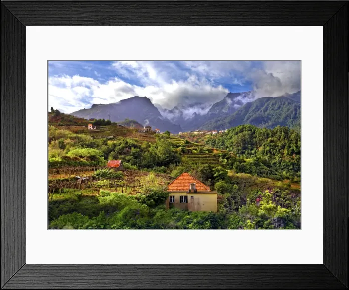 Framed Print : Elevated view of village and tree covered hills and mountains at Lameiros, near Sao Vicente Framed Print : Elevated view of village and tree covered hills and mountains at Lameiros, near Sao Vicente