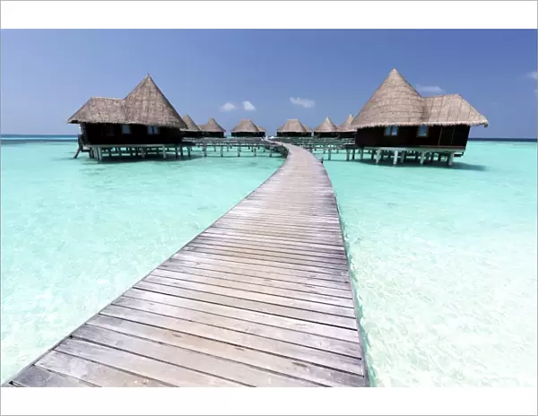 Over-water villas, crystal clear sea and blue sky, Coco Palm, Dhuni Kolhu, Baa Atoll