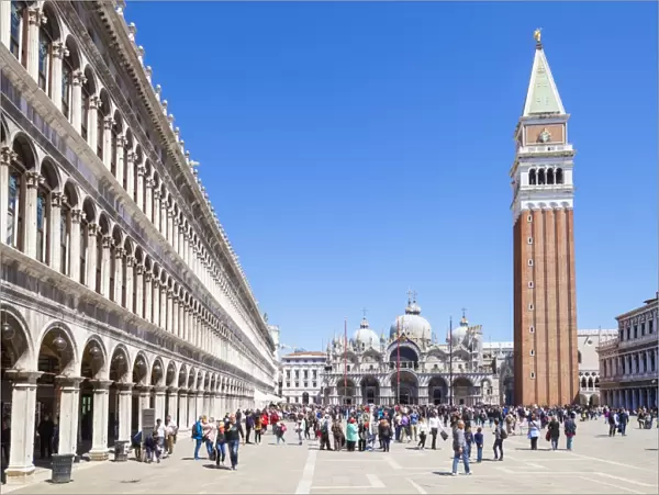 Campanile tower, Piazza San Marco (St. Marks Square) with tourists and Basilica di San Marco