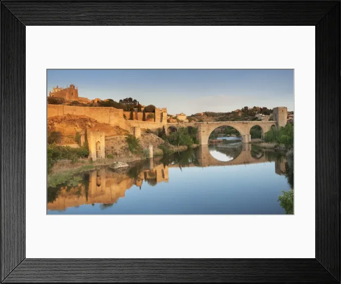 Framed Print : Puente de San Martin Bridge and San Juan des los Reyes Monastery reflected in the Tajo River Framed Print : Puente de San Martin Bridge and San Juan des los Reyes Monastery reflected in the Tajo River