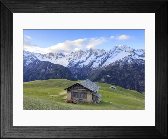 Framed Print : Meadows and wooden huts framed by snowy peaks at dawn, Tombal, Soglio, Bregaglia Valley Framed Print : Meadows and wooden huts framed by snowy peaks at dawn, Tombal, Soglio, Bregaglia Valley