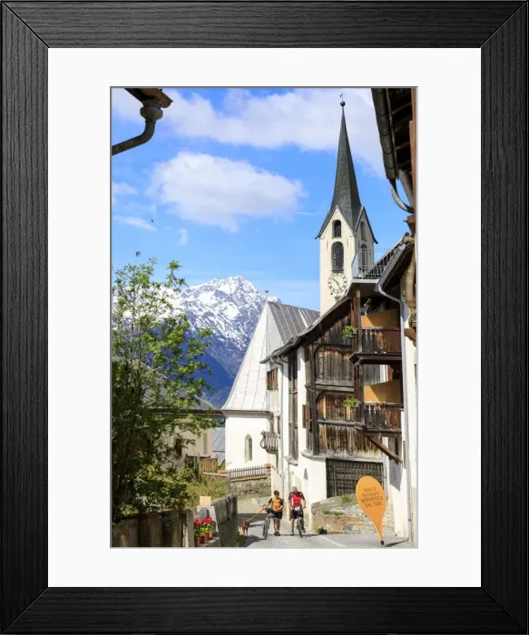 Framed Print : Bicycles in the old town framed by snowy peaks, Guarda, Inn District, Lower Engadine
