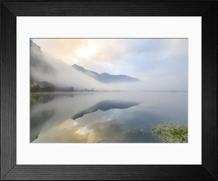 Framed Print : Mountains reflected in water at dawn shrouded by mist, Pozzo di Riva Novate, Mezzola Framed Print : Mountains reflected in water at dawn shrouded by mist, Pozzo di Riva Novate, Mezzola