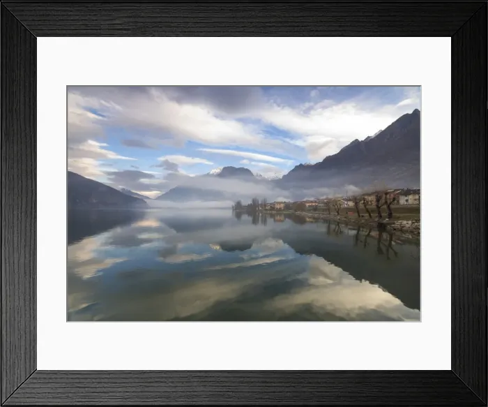 Framed Print : Mountains and village are reflected in Lake Mezzola at dawn shrouded by mist, Verceia Framed Print : Mountains and village are reflected in Lake Mezzola at dawn shrouded by mist, Verceia