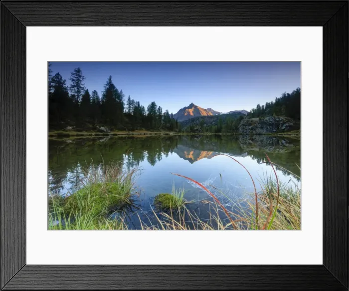 Framed Print : Rocky peak of Sasso Moro reflected in Lake Mufule at dawn, Malenco Valley, Province of Sondrio Framed Print : Rocky peak of Sasso Moro reflected in Lake Mufule at dawn, Malenco Valley, Province of Sondrio
