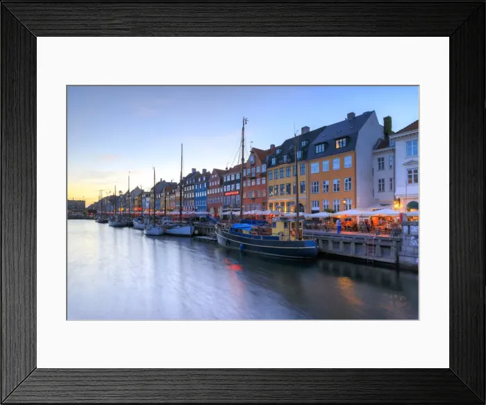 Framed Print : Blue lights of dusk on harbour and canal of the entertainment district of Nyhavn Framed Print : Blue lights of dusk on harbour and canal of the entertainment district of Nyhavn