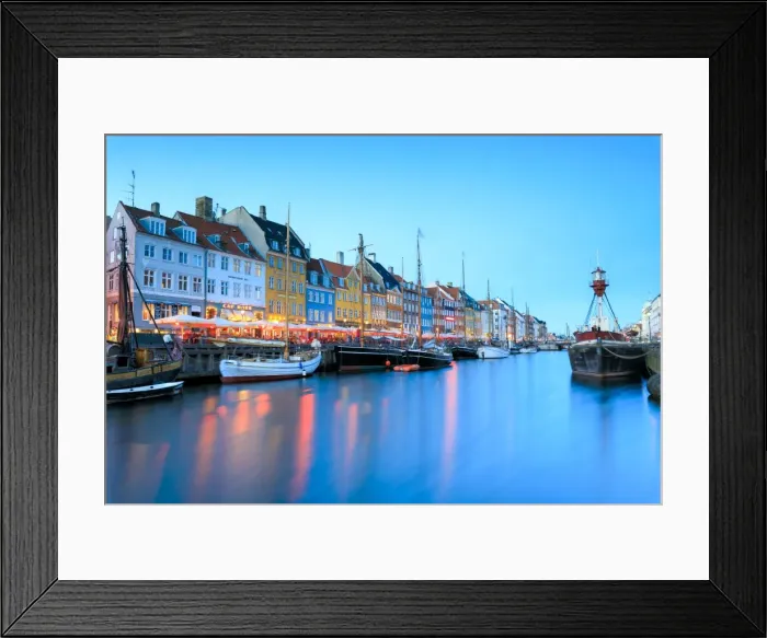 Framed Print : Night view of the illuminated harbour and canal of the entertainment district of Nyhavn Framed Print : Night view of the illuminated harbour and canal of the entertainment district of Nyhavn
