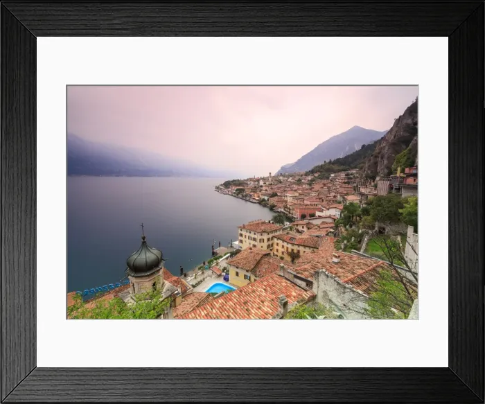Framed Print : Pink sunrise lights up Lake Garda and the typical town of Limone Sul Garda, province of Brescia Framed Print : Pink sunrise lights up Lake Garda and the typical town of Limone Sul Garda, province of Brescia