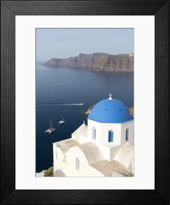 Framed Print : White church with blue dome overlooking the Caldera, Oia, Santorini, Cyclades Islands Framed Print : White church with blue dome overlooking the Caldera, Oia, Santorini, Cyclades Islands