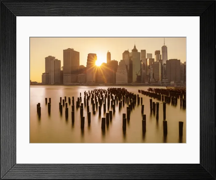 Framed Print : Lower Manhattan skyline, New York skyline, exposed wooden pier stumps, at sunset Framed Print : Lower Manhattan skyline, New York skyline, exposed wooden pier stumps, at sunset
