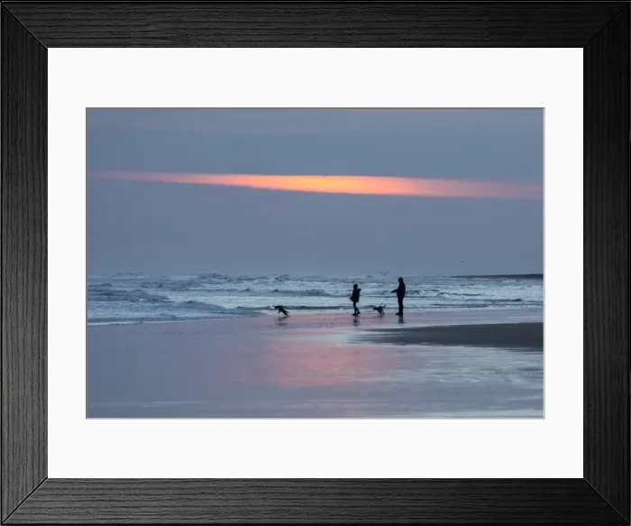 Framed Print : Dog walkers in silhouette on Bamburgh Beach at sunrise, Bamburgh, Northumberland Framed Print : Dog walkers in silhouette on Bamburgh Beach at sunrise, Bamburgh, Northumberland