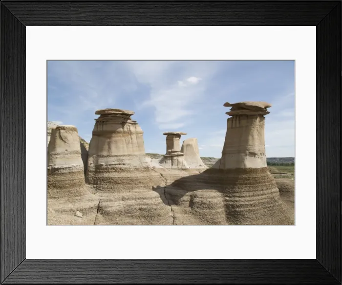 Framed Print : The hoodoos, rock formations formed by the erosion of Bentonite, in the Badlands Framed Print : The hoodoos, rock formations formed by the erosion of Bentonite, in the Badlands