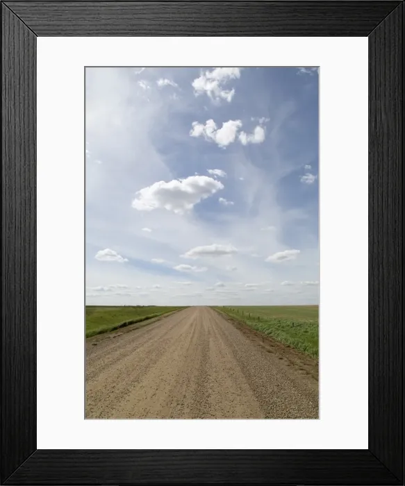 Framed Print : Clouds and blue sky over a dirt track in the Badlands of Alberta, near Drumheller Framed Print : Clouds and blue sky over a dirt track in the Badlands of Alberta, near Drumheller