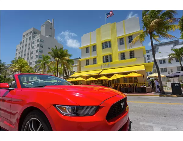 Art Deco architecture and red sports car on Ocean Drive, South Beach, Miami Beach