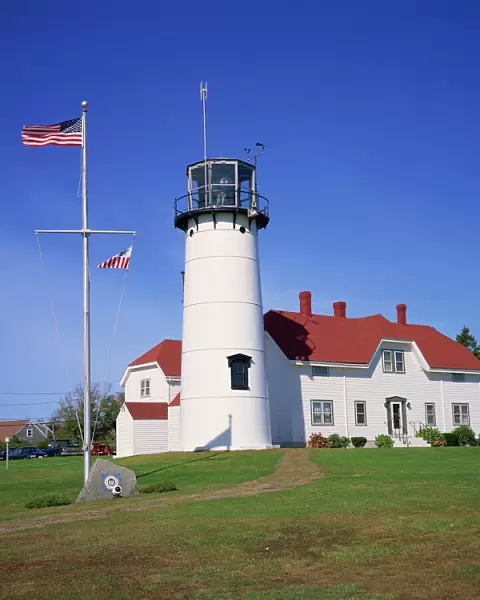 485-2813. The American flag flying beside the Chatham lighthouse at Cape Cod