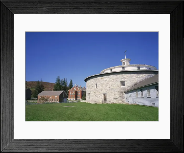 Framed Print : Circular building with houses in the background at the Hancock Shaker Village Framed Print : Circular building with houses in the background at the Hancock Shaker Village
