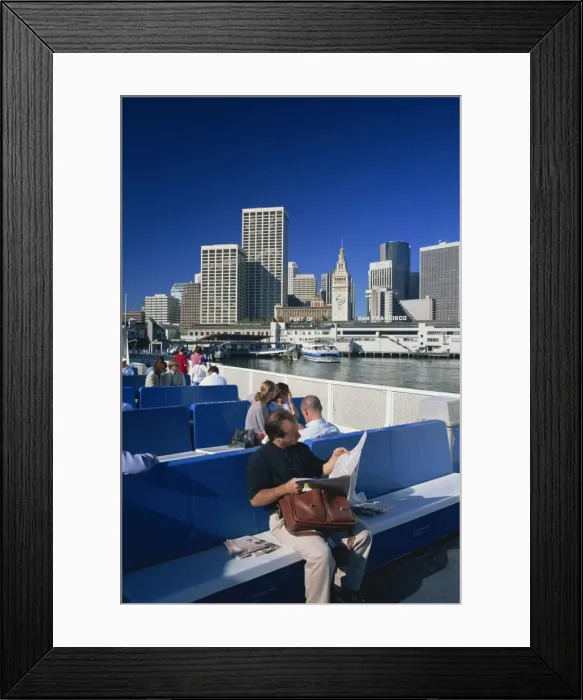 Framed Print : Man reading newspaper and passengers on the commuter ferry Framed Print : Man reading newspaper and passengers on the commuter ferry
