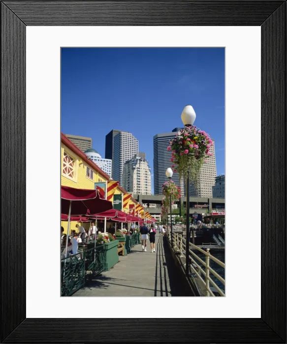 Framed Print : Cafes on Pier 56 on the waterfront with tower blocks