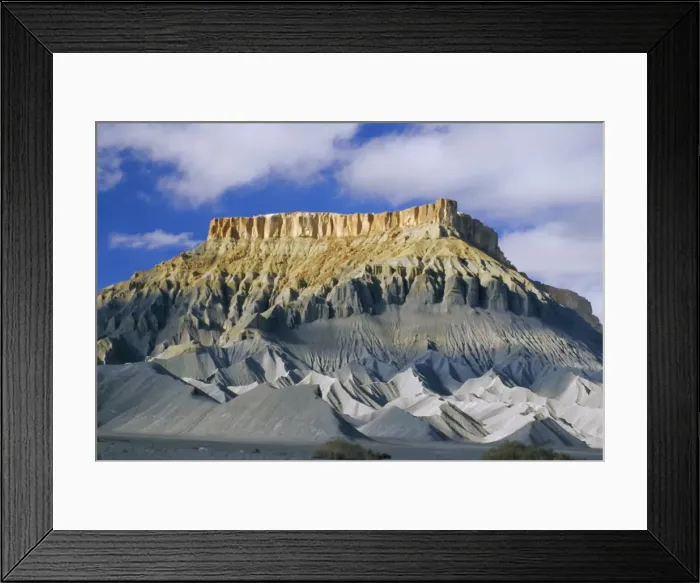 Framed Print : Mesaverde Sandstone cliff over gullied slopes of grey Mancos Shale Framed Print : Mesaverde Sandstone cliff over gullied slopes of grey Mancos Shale