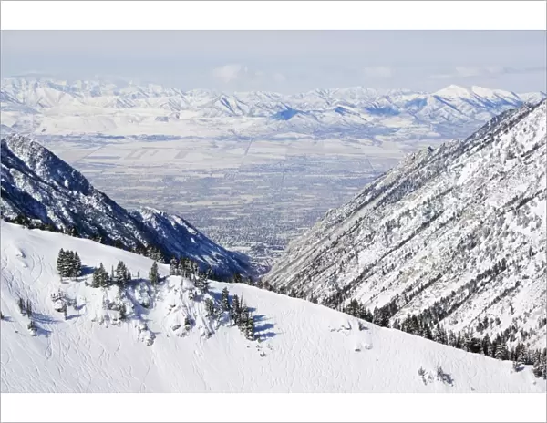 Salt Lake Valley and fresh powder tracks at Alta