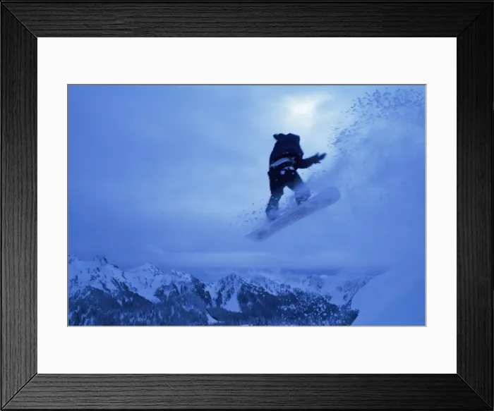 Framed Print : Snowboarder heads down