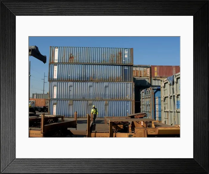 Framed Print : Worker walks towards rail car Framed Print : Worker walks towards rail car