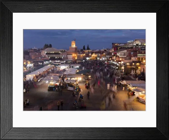 Framed Print : View over the Djemaa el Fna at dusk showing food stalls and crowds of people, Marrakech