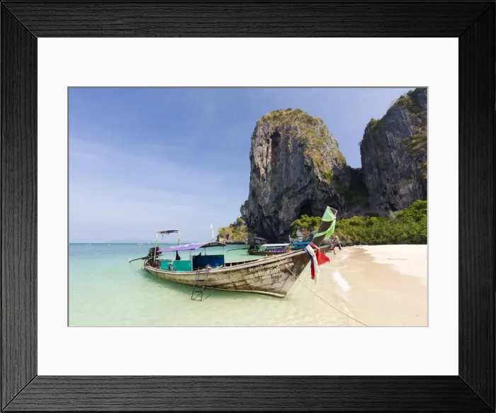 Framed Print : Traditional Longtail boats moored by Phra Nanag Beach with limestone cliffs in the background Framed Print : Traditional Longtail boats moored by Phra Nanag Beach with limestone cliffs in the background