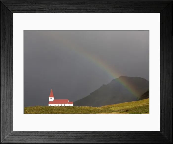Framed Print : Church and rainbow against stormy sky and mountains, Vik Y Myrdal, South Iceland Framed Print : Church and rainbow against stormy sky and mountains, Vik Y Myrdal, South Iceland