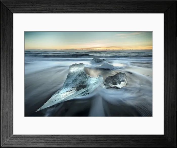 Framed Print : Pieces of glacier ice washed up on black volcanic sand beach at sunrise, near Jokulsarlon Framed Print : Pieces of glacier ice washed up on black volcanic sand beach at sunrise, near Jokulsarlon