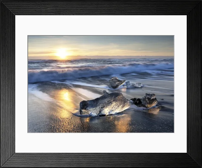 Framed Print : Pieces of glacier ice washed up on black volcanic sand beach at sunrise, near Jokulsarlon Framed Print : Pieces of glacier ice washed up on black volcanic sand beach at sunrise, near Jokulsarlon